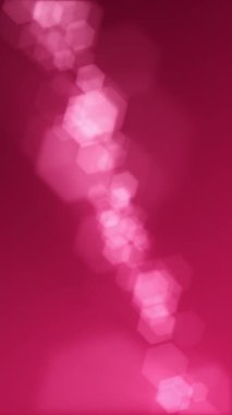 Dikey video - Odaklanmış bokeh ışıkları arka plan. Altıgen lens bulanık bokeh parçacıkları ile bu zarif morumsu arka plan animasyonu tam HD ve dikişsiz bir döngüdür.