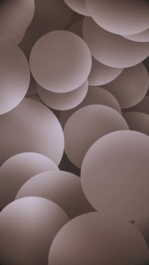 Dikey video - yavaşça hareket eden sıcak gölgeli küreler soyut arkaplan. Bu rahatlatıcı geometrik şekiller animasyon tam HD ve kusursuz bir döngüdür..