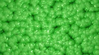 Canlı, yeşil balçık salgılayan soyut bir arka plan. Organik hücresel yapıların mikroskobik görüntüsü. Uzaylı organizması ya da doku konsepti. Tam HD ve döngü hareketi arkaplanı.