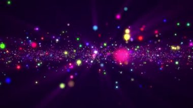 Parlak renkli parçacıklar ve parıldayan ışık huzmeleriyle soyut parçacık arkaplanı. Bu canlı, çok renkli arka plan animasyonu tam HD ve bir döngüdür.