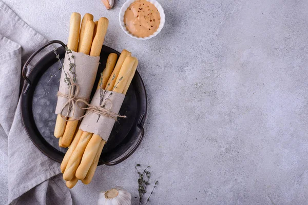 stock image Italian grissini, traditional appetizer breadstick with garlic