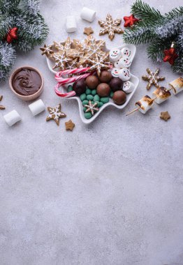 Christmas plate with snacks and sweets, cookies and marshmallow