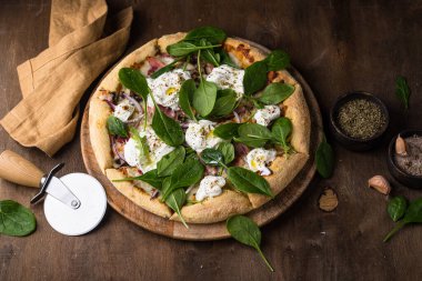 Italian pizza with soft cheese burrata or mozzarella and herbs