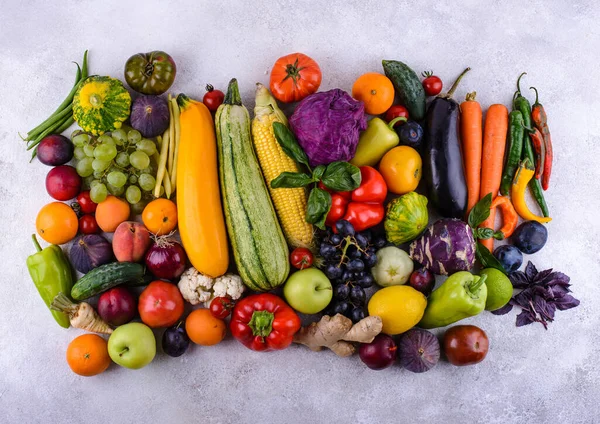 Assortment of red, yellow, green, orange, purple vegetables and fruits. Rainbow food
