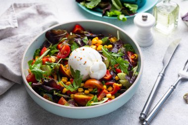Burrata cheese with vegetable salad. Italian food