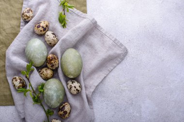 Festive Easter eggs painted in green color