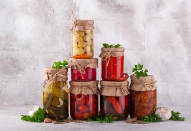 Pickled preserves vegetables in glass jars. Fermented food clipart