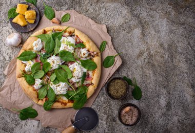 Italian pizza with soft cheese burrata or mozzarella and herbs