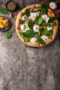 Italian pizza with soft cheese burrata or mozzarella and herbs