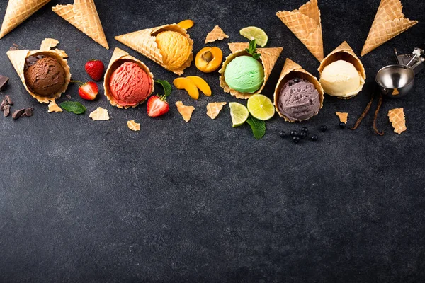 stock image Assortment of different taste of ice cream in wafle cone