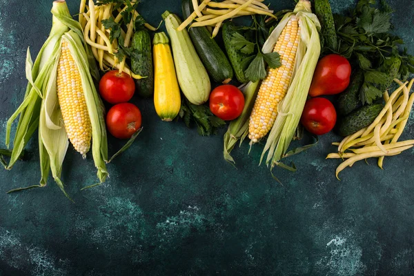 stock image Assortment of various vegetables. Summer harvest. Healthy vegan food on green background