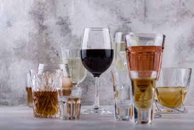 Assortment of strong and soft alcohol drinks. Cognac, scotch, whiskey, tequila, vodka, red and white wine, champagne