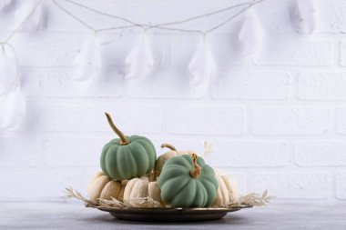 Elegant no scary Halloween decor with white pumpkin and skull