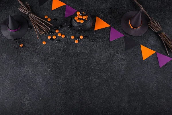 stock image Halloween festive background with witches hat, cauldron and broom