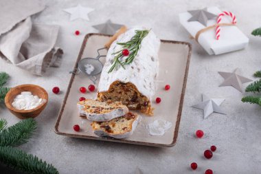 Stollen, traditional festive German Christmas cake with dried fruits