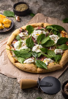 Italian pizza with soft cheese burrata or mozzarella and herbs