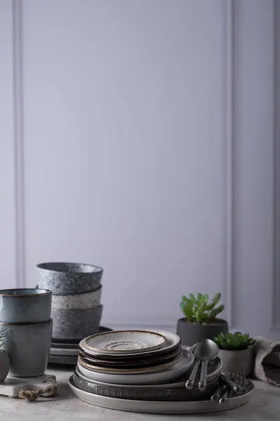 Handmade craft ceramic tableware, plates, bowls and cups. Scandinavian style