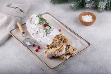Stollen, traditional festive German Christmas cake with dried fruits
