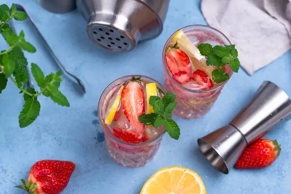 Strawberry lemonade with lemon. Refreshing summer cocktail