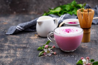 Pink matcha latte with milk. Trendy drink from dragon fruit powder clipart