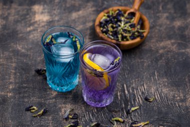 Cold blue and purple tea Butterfly pea with lemon and ice clipart