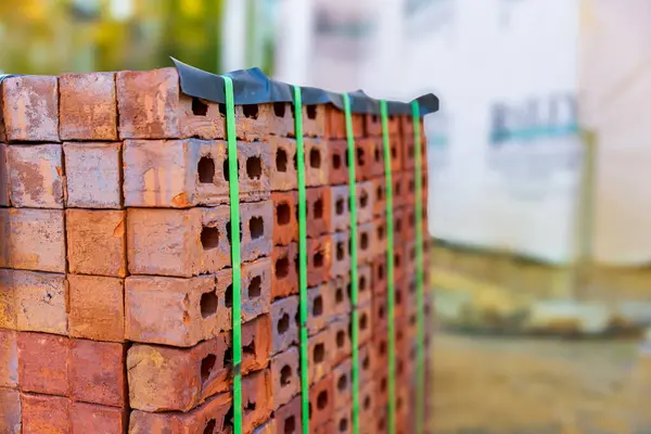 Stack of bricks for home construction with copy space