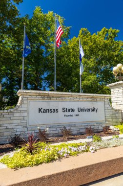 Manhattan, KS - September 2024: Kansas State University sign and flags clipart