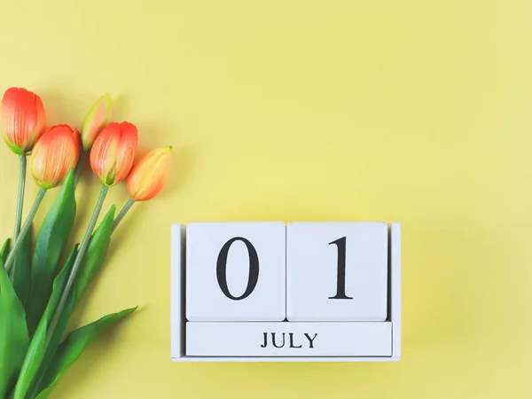 Top View Flat Lay Wooden Calendar Date July Yellow Background — Stock Photo, Image