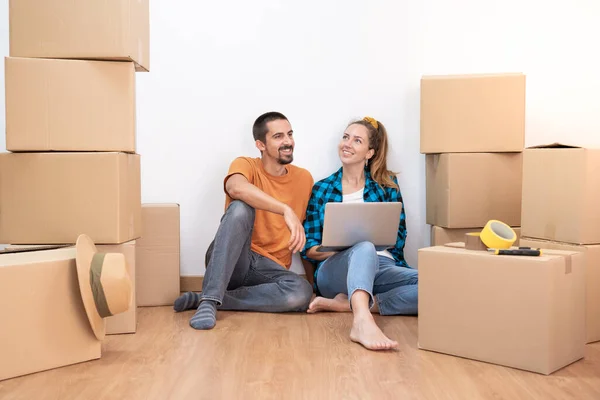 stock image Attractive young couple with moving boxes becoming independent and opening a new home household move. High quality photo