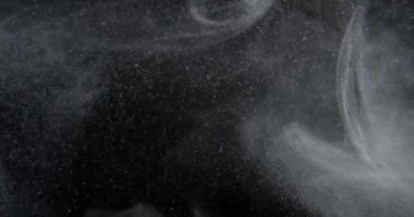 System of dust particles on black screen overlay. Filmed with RED camera in slow motion. Abstract shapes background. High quality 4k footage