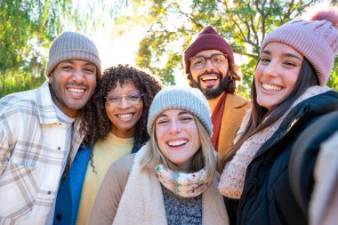 Friends taking selfie smiling happy looking at camera having fun together. Concept of real people community, youth lifestyle and friendship. High quality photo