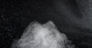 System of dust particles on black screen overlay. Filmed with RED camera in slow motion. Abstract background. High quality 4k footage