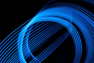 Abstract neon lights glow and flash effect. Background with flying design elements. Blue background. High quality photo