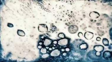 Old damaged abstract grunge surface on black background. Retro vintage effect. High quality 4k footage