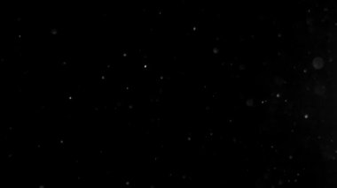 Siyah ekrandaki atmosferik toz parçacıkları ve ışık sızıntısı etkisi. Yüksek kalite 4k görüntü