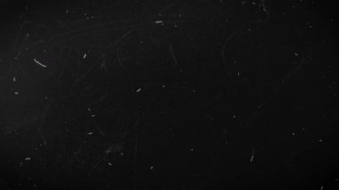 Soyut Toz, çizikler, Kara Vintage 'a Karşı Doku Parçacıkları. Süper 8 karalama kaplaması. Yüksek kalite 4k görüntü