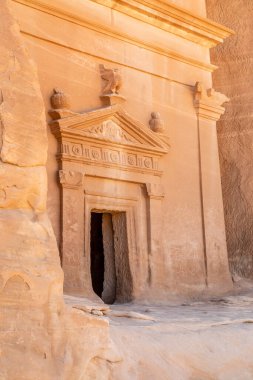 Carved ornamented entrance to the tomb at Jabal al banat complex, Hegra, Al Ula, Saudi Arabia clipart