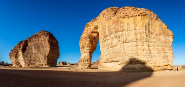 Sandstone elephant rock erosion monolith standing in the desert, Al Ula, Saudi Arabia clipart