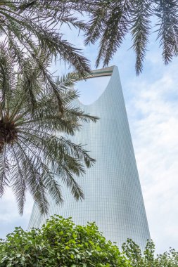 Modern buildings in the Al Olaya downtownt district with palms in the foreground, Al Riyadh, Saudi Arabia clipart