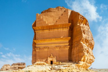 Entrance to the ancient nabataean Tomb of Lihyan, son of Kuza carved in rock in the desert,  Mada'in Salih, Hegra, Saudi Arabia clipart
