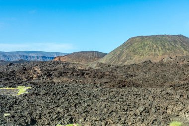Ardoukoba fissure vents volcano crater cone with lava fields in the foreground, Tajourah Djibouti clipart