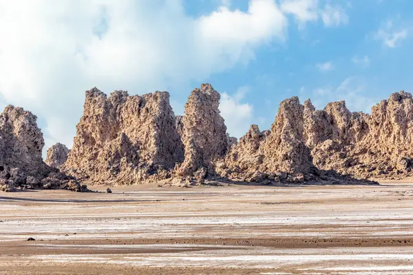 stock image Limestone prehistoric chimneys geological rock formations at dried bottom of salt lake Abbe, Dikhil region, Djibouti