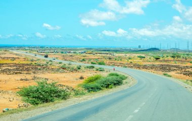 Asphalt road through djiboutian savanna, Arta region, Djibouti clipart