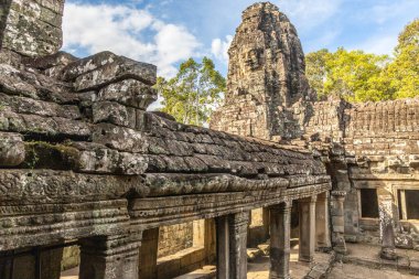 Ancient Bayon temple with carved stone faces, Angkor Thom, Siem Reap, Cambodia clipart