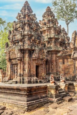 Statues guarding at the entrance to hindu Banteay Srei khmer temple, Angkor Archaeological Park, Siem Reap, Cambodia clipart