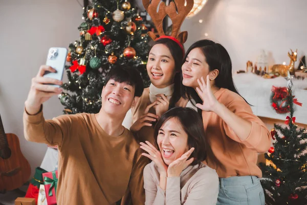 Group Young Asian Friends Celebrating Christmas New Year Evening Sitting Stock Photo