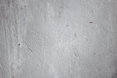 light concrete wall with cracks and scratches 