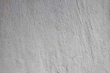 light concrete wall with cracks and scratches 