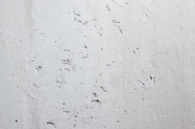 abstract texture of light concrete wall with cracks and scratches, background for copy space 