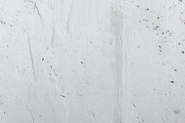 abstract texture of light concrete wall with cracks and scratches, background for copy space 